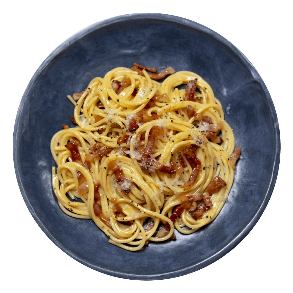 Carbonara sprinkled with cheese and pepper in a rustic blue bowl. | GLOBAL-7ujaepWhXYZVgI1hRjPL9E